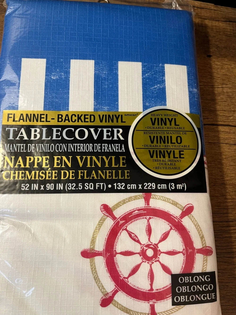 Vinyl Tablecover with Blue Stripes & Red Nautical Wheel Theme from Party City